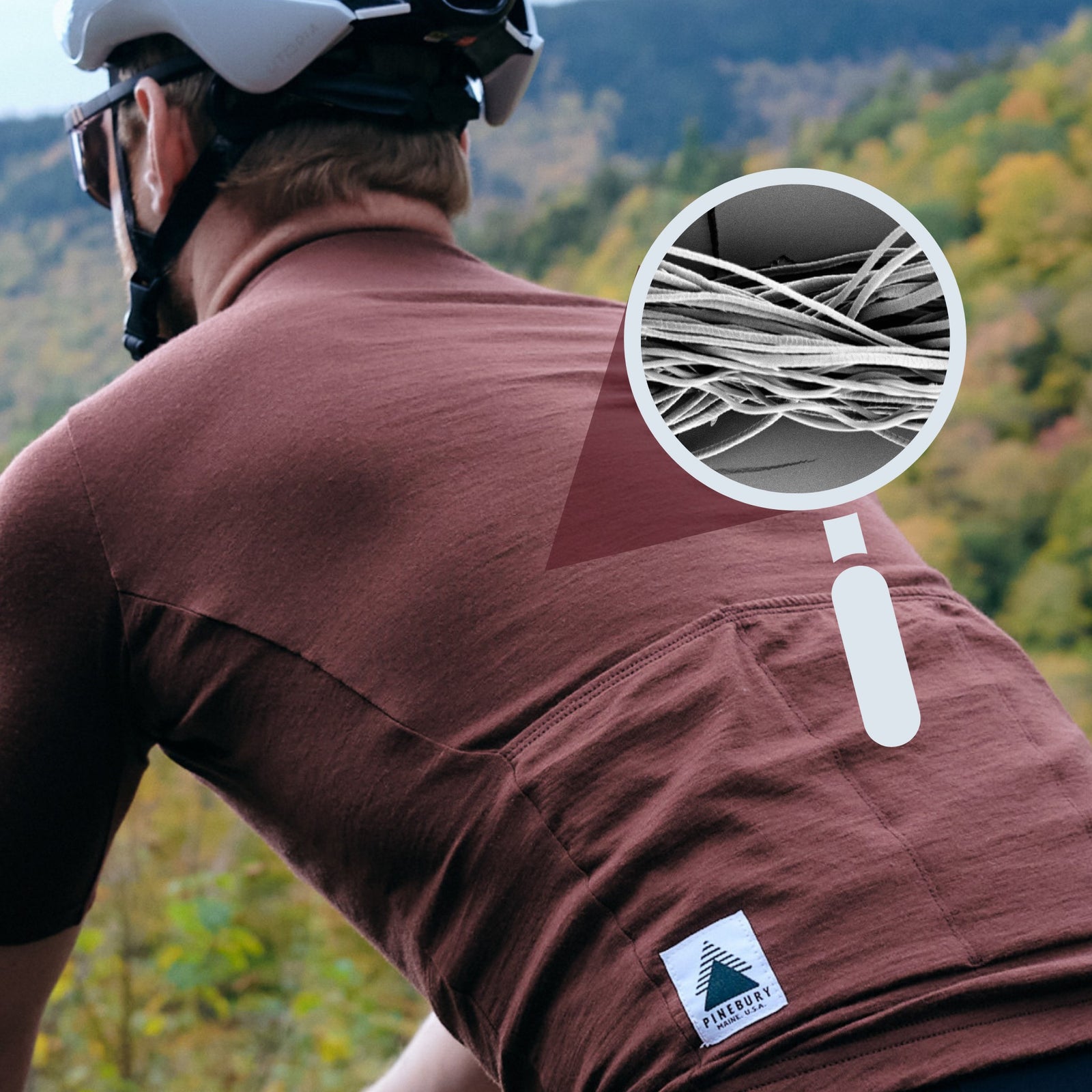 A photo showing the back of a Pinebury Grafton Short Sleeve Merino Wool Jersey in Brick Red with a magnifying glass illustration showing a microscopic view of the merino wool fibers and how they are not twisted.