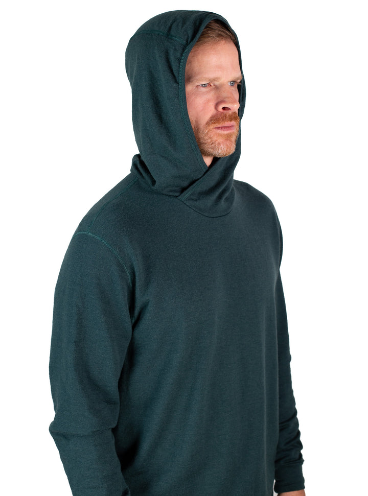 Man wearing a dark green hoodie on a white background