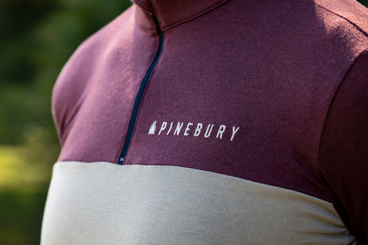 Close-up of the quarter zip collar and chest band on the Brick Red Every-Season Quarter Zip Jersey