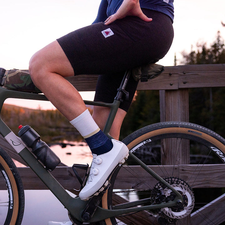 Pinebury merino wool bib shorts on a gravel ride at sunset